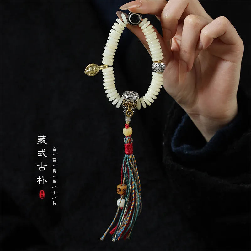 White Bodhi seed Tibetan bracelet showing 3x10mm dimensions in bracelet and handheld styles