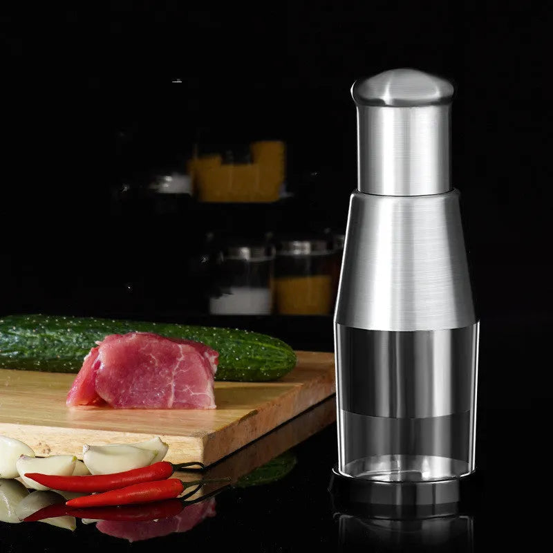 Black manual garlic press and vegetable chopper with stainless steel blades measuring 6x16cm